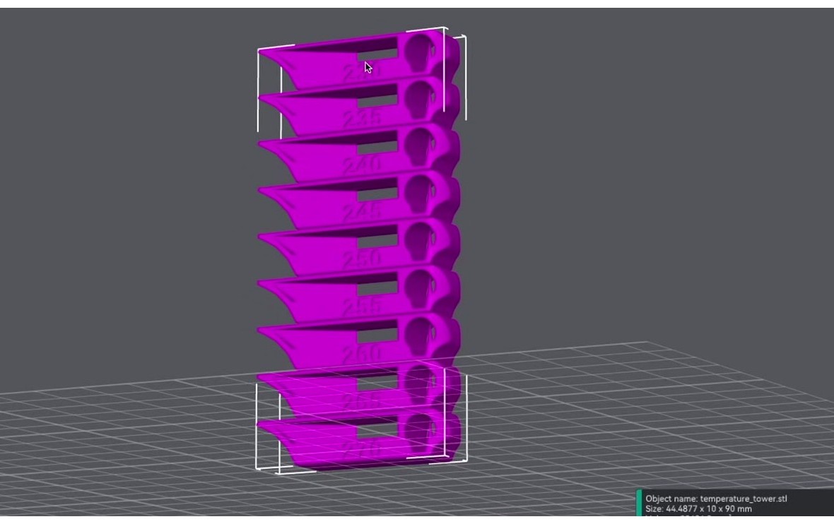 The temperature tower model loaded on the OrcaSlicer build plate showing the embossed labels per band