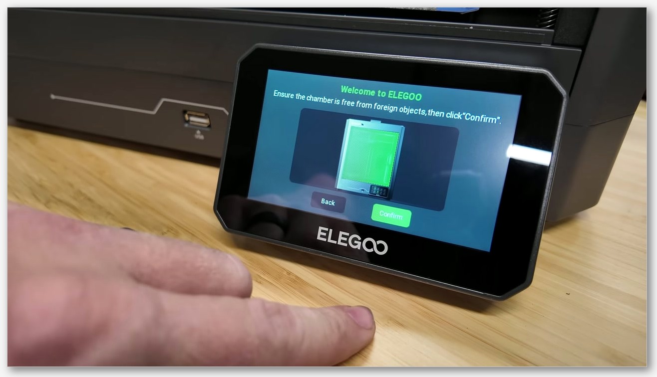 Official Elegoo product render of the CC1, fully enclosed, door open, build plate visible