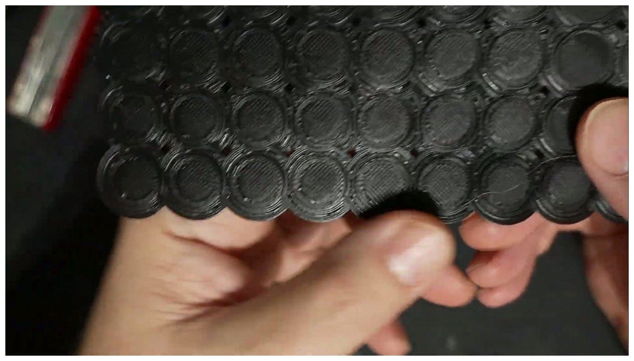 Close-up macro of an ironed top surface showing the parallel line pattern of rectilinear ironing