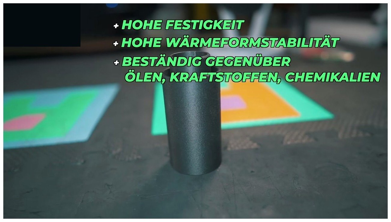 Printed nylon tube on the build plate with German text overlay reading high strength